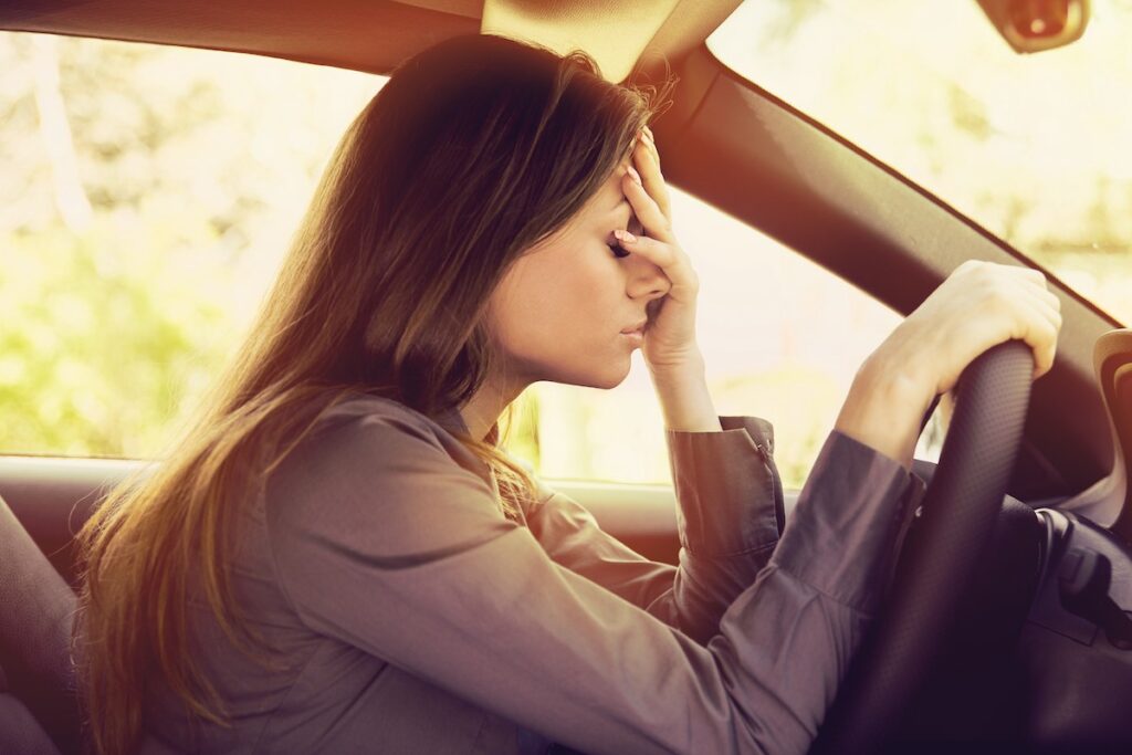 Stressed woman driver after a minor car accident in Florida