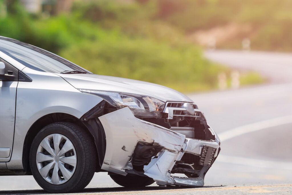 Front of silver car get damaged by crash accident in Peoria