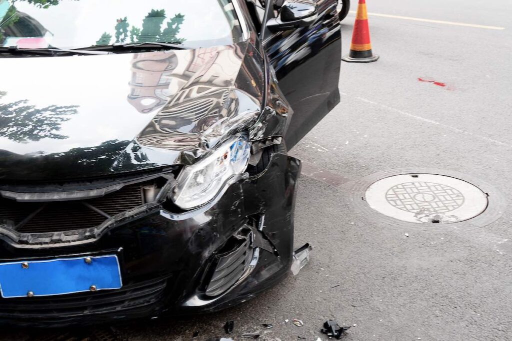 Close up image of a black car after a car crash in Tempe