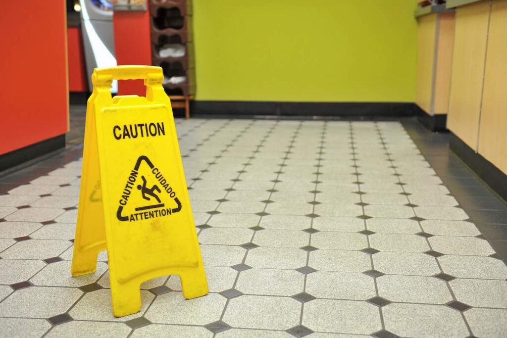 Restaurant wet floor sign to avoid slip and fall accident
