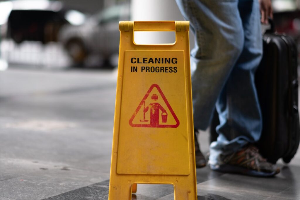 Sign showing warning of caution wet floor to avoid slip and fall injury