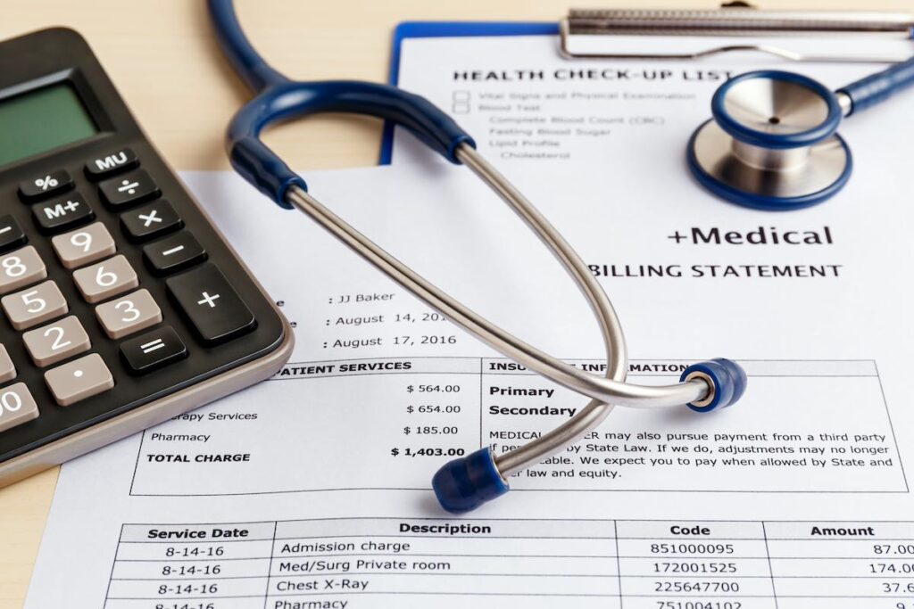 medical bills reimbursement with calculator and stethoscope